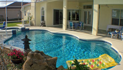 A swimming pool spa and patio.