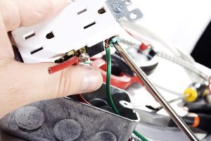 electrician doing outlet repair